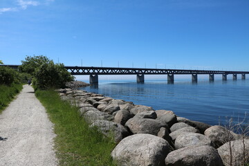 Fototapeta na wymiar Summer at coastal shore around Malmö on the Baltic Sea, view to Öresund Bridge, Sweden