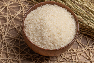 Fototapeta na wymiar White rice, Masu and ears of rice on a white background