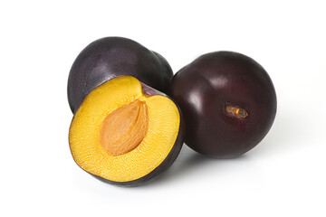 Plum and half plum isolated on white background
