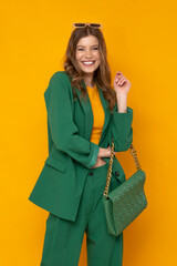 Shocked fashionable model wear in oversize green suit and high heels. 