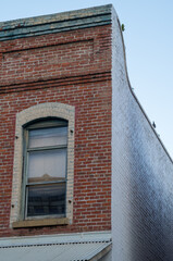 Vintage Red Brick Building Corner Wall with White Paint.