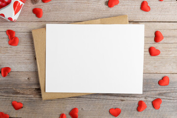 Valentines day card, blank invitation stationery card mockup with envelope and red hearts on wooden...