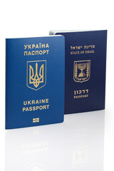 Israeli and Ukrainian foreign passports isolated on white background. Close-up.
