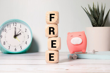 the word free on wooden blocks on black background. Business concept