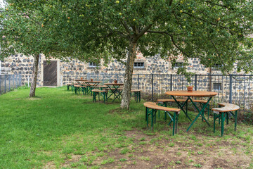 Empty cafe tables on the outdoor terrace.