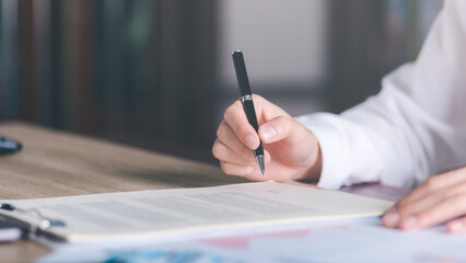 Businessman validates and manages business documents and agreements. , signing a business contract...