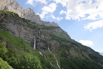 View on waterfalls in the Cirque du Fer-à-Cheval which is a natural circus of France located in the territory of the commune of Sixt-Fer-à-Cheval, in the department of Haute-Savoie