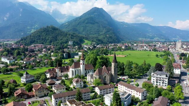 Aerial view over the city of Interlaken in Switzerland. Beautiful view of Interlaken town, Eiger, Monch and Jungfrau mountains and of Lake Thun and Brienz. Interlaken, Bernese Oberland, Switzerland.