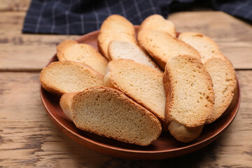 Plate of hard chuck crackers on wooden table