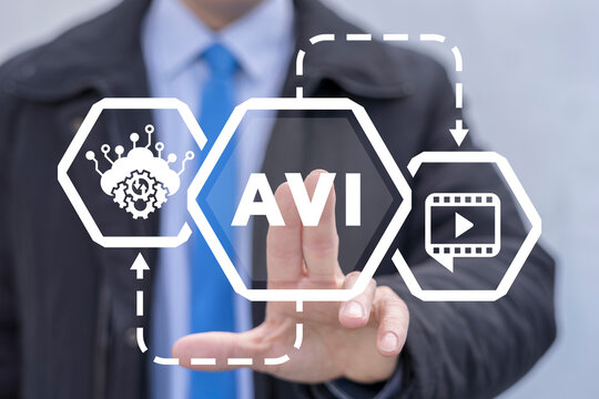Businessman using virtual touchscreen presses abbreviation: AVI. Concept of AVI Audio Video Interleaved Business Technology.