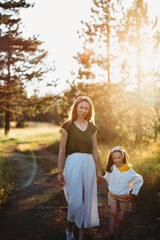 Fototapeta premium Mother and daughter walking