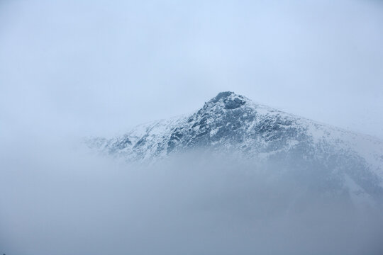 A rock formation called Lion's Head in the mist and fog on the shoulder of Mt. Washington, NH.