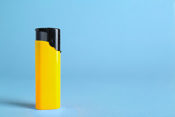 Stylish small pocket lighter on white background, space for text