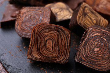 Different tasty chocolate candies on table, closeup