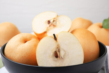 Bowl with delicious apple pears, closeup view