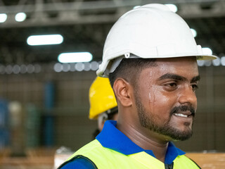 Person black skin african india middle east head shot face wear white hardhat helmet safety warehouse construction employee labor staff employee work job construction engineer happy smile concept     