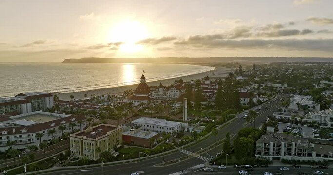 San Diego California Aerial v102 breathtaking view flyover and around grand victorian hotel del coronado at sunset with beautiful golden sunlight reflection - Shot with Mavic 3 Cine - September 2022
