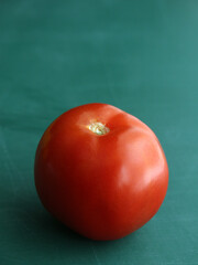 tomato on a green background