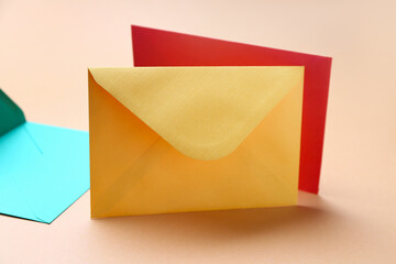 Colorful paper envelopes on color background