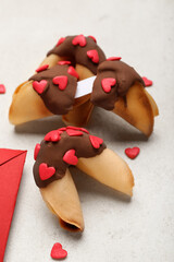 Tasty fortune cookies on light background, closeup. Valentine's Day celebration