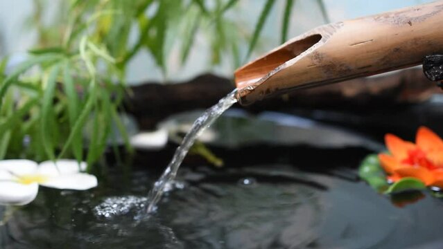 Flowing water, bamboo trough, spa concept