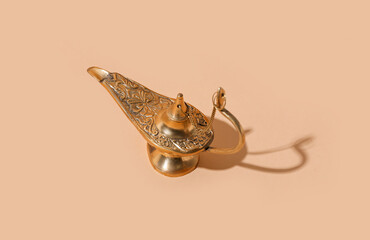 Aladdin lamp of wishes for Ramadan on beige background