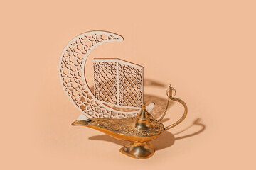 Aladdin lamp of wishes and decorative crescent for Ramadan on beige background