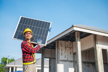 Technicians carrying solar panels ready to be installed on the roof of a housing estate energy-saving and cost-saving concept Own a small business installing solar panels.