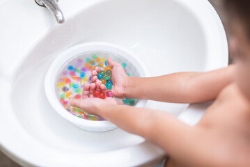 Happy boy - playing with the orbeez balls