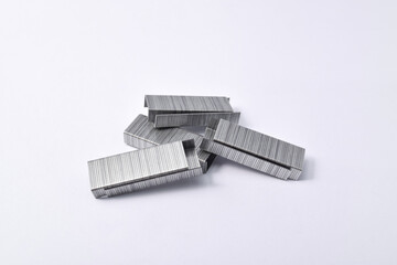 Pile of metal staples for stapler isolated on white background