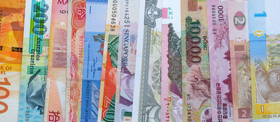 Country multi-currency banknotes and currency exchange concept