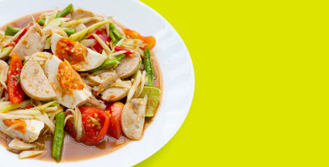 Spicy papaya salad with salted egg and vietnamese pork sausage