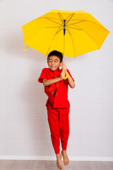 little boy fashion Smiling child in red chinese dress, style and fashion ideas for children. chinese new year
