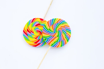 Rainbow lollipop on white background.