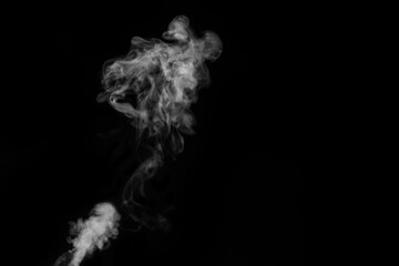 Close-up view of white water vapor with spray from the humidifier. Isolated on black background. steam smoke