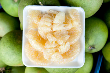 Fresh, peeled and green grapefruit Healthy fruit food