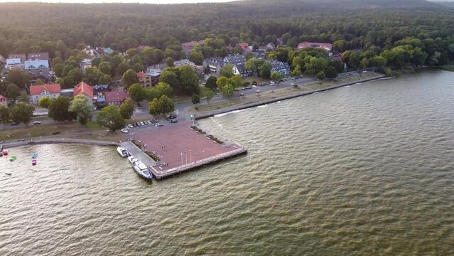 AERIAL Orbiting Shot of a Resort Town Juodkrante Harbor in Lithuania