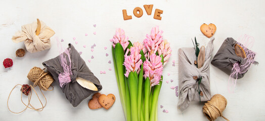 Valentine's Day Zero Waste Concept. Eco-friendly linen packaging as a gift for Valentine's Day in...