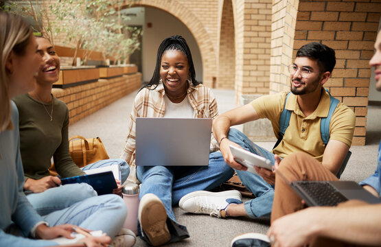 Diversity, laptop and students on ground, conversation and connection for study session, brainstorming and group project. Academics, young people or friends sitting, talking and collaboration outdoor