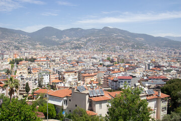 Fototapeta na wymiar Mountains View of the city of Alanya and the roofs of houses