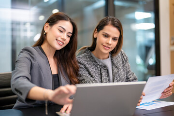 Businesswoman talking to colleague