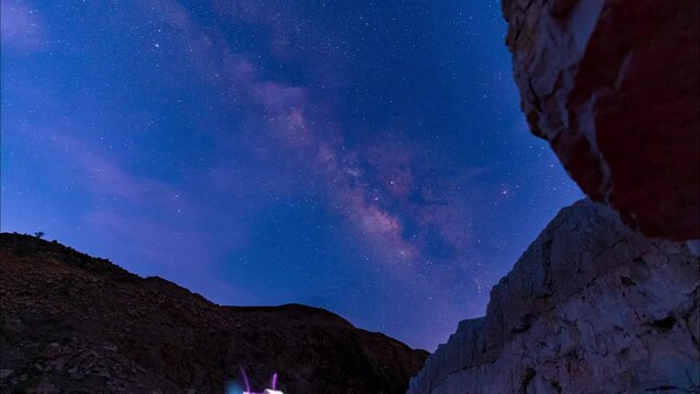 Starry night and Dark sky with milky way galaxy n stars are shining moving over the canyon surrounded  by rocky mountain in Alborz Zagros in Iran
Stargazing and wedding photography of nature landscape