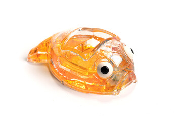 Toy plastic tropical fish isolated on white background.