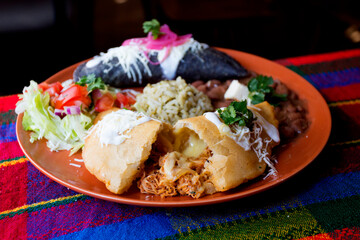 Mexican combo plate with stuffed corn Empanadas