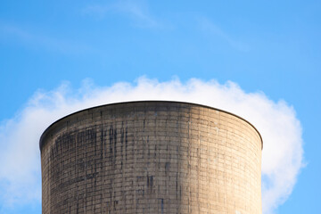 Steam rising from a power station cooling tower