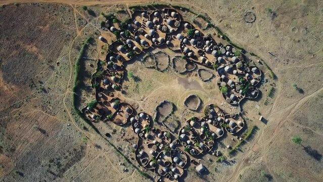 Drone view from above the center of a village in the Karamoja region, also called Manyatta or Ere, in Uganda, during a sunny day.