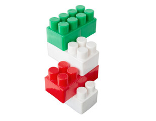 assembled parts of a children's plastic constructor on an isolated background. colored cubes