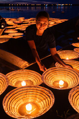 Thai people release floating lanterns in the river as a tradition to ask for forgiveness. The Mekong River is the main river of Thailand.
