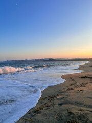 Sunset on the beach. Sea view. On the shore of the Japanese sea.