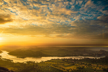 sunrise at tungabadra  river in India in the mountains